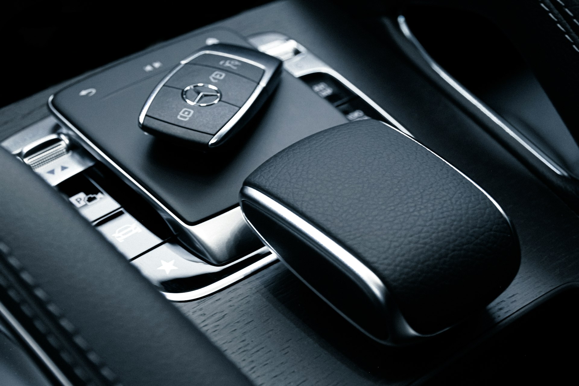 black and silver mercedes benz steering wheel